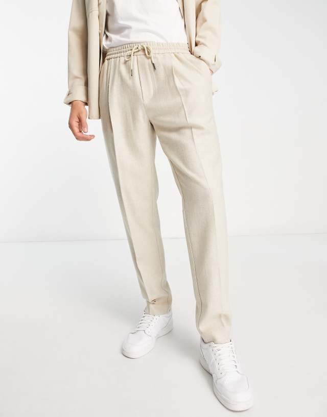 Topman tapered wool mix pleat pants with elasticated waistband in off white