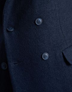 Model wearing Textured double breasted wool blend coat in navy  