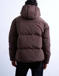 Model wearing Textured puffer jacket in dark brown