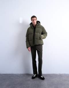 Model wearing Textured puffer jacket in dark khaki