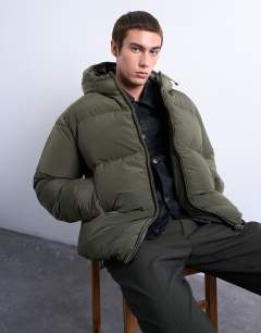 Model wearing Textured puffer jacket in dark khaki