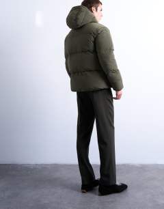 Model wearing Textured puffer jacket in dark khaki
