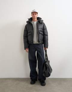 Model wearing Textured puffer with detachable hood in black