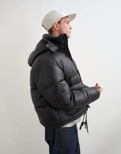 Model wearing Textured puffer with detachable hood in black