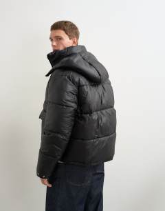 Model wearing Textured puffer with detachable hood in black