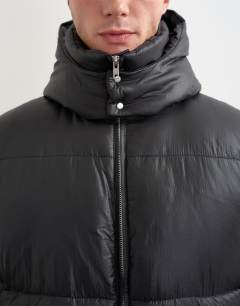 Model wearing Textured puffer with detachable hood in black