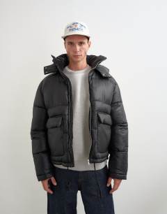 Model wearing Textured puffer with detachable hood in black