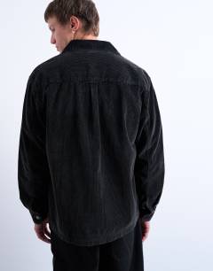 Model wearing Washed cord overshirt in black