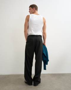 Model wearing Wide leg belted pinstripe trouser with pleats in black
