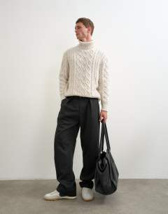 Model wearing Wide leg belted pinstripe trouser with pleats in grey
