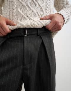 Model wearing Wide leg belted pinstripe trouser with pleats in grey
