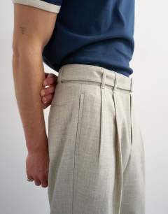 Model wearing Wide leg belted textured trouser in stone
