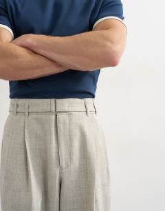Model wearing Wide leg belted textured trouser in stone