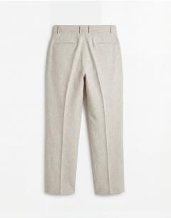 Model wearing Wide leg belted textured trouser in stone