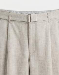 Model wearing Wide leg belted textured trouser in stone