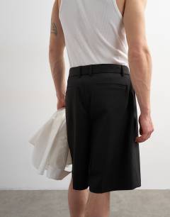 Model wearing Wide leg belted twill short in black