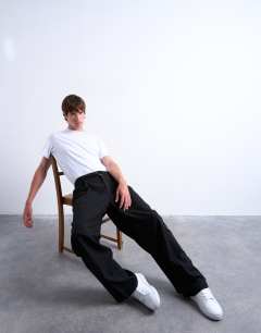 Model wearing Wide leg belted twill smart trousers in black