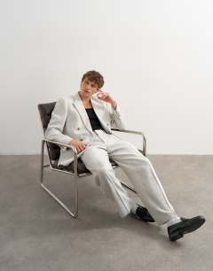 Model wearing Wide leg boucle textured trousers in cream