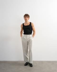 Model wearing Wide leg boucle textured trousers in cream