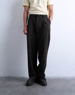 Model wearing Wide leg check smart trousers in chocolate