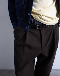 Model wearing Wide leg check smart trousers in chocolate