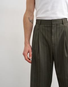 Model wearing Wide leg  herringbone stripe trouser in charcoal