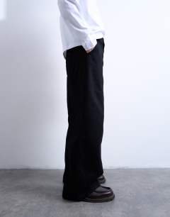 Model wearing Wide leg jean in black