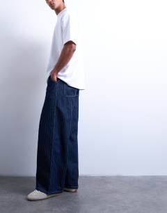 Model wearing Wide leg jean with seam in stripe