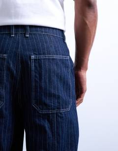 Model wearing Wide leg jean with seam in stripe