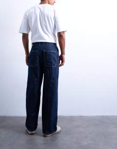 Model wearing Wide leg jean with seam in stripe