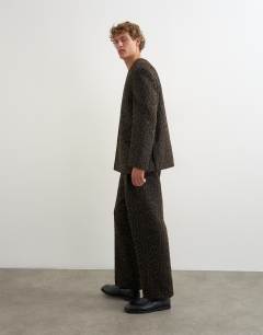 Model wearing Wide leg leopard print trouser in brown
