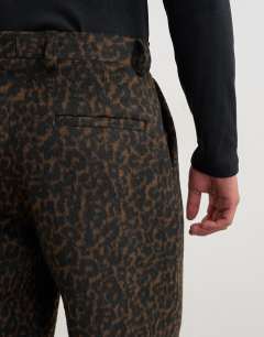 Model wearing Wide leg leopard print trouser in brown