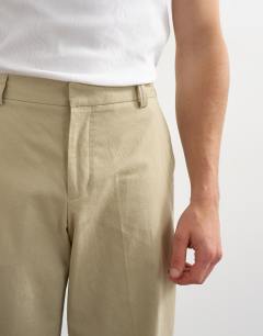 Model wearing Wide leg linen trouser in beige