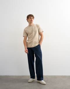 Model wearing Wide leg linen trouser in navy