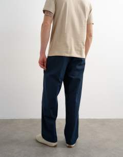 Model wearing Wide leg linen trouser in navy