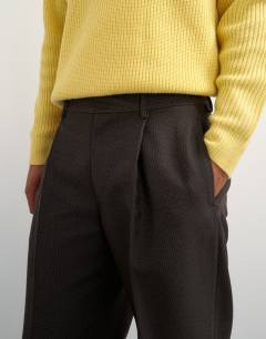 Model wearing Wide leg micro check trouser with pleats in brown