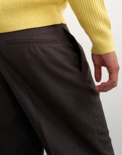 Model wearing Wide leg micro check trouser with pleats in brown