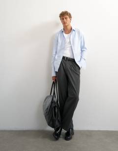 Model wearing Wide leg pinstripe trouser with pleats in charcoal