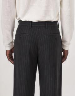 Model wearing Wide leg pinstripe trouser with pleats in charcoal