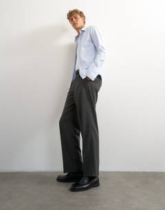 Model wearing Wide leg pinstripe trouser with pleats in charcoal