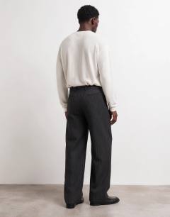 Model wearing Wide leg pinstripe trouser with pleats in charcoal