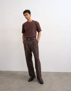 Model wearing Wide leg pinstripe trousers in brown