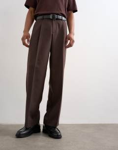 Model wearing Wide leg pinstripe trousers in brown
