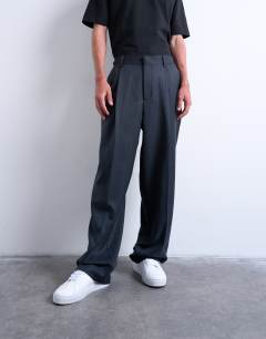 Model wearing Wide leg pleated stripe trouser in grey