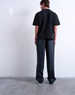 Model wearing Wide leg pleated stripe trouser in grey