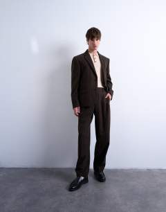 Model wearing Wide leg pleated trouser in brown stripe