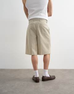 Model wearing Wide leg stripe short in stone