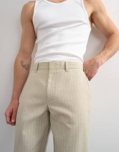 Model wearing Wide leg stripe trouser in stone