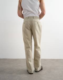 Model wearing Wide leg stripe trouser in stone