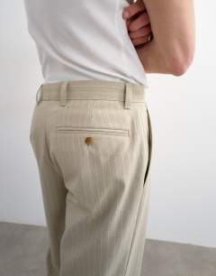 Model wearing Wide leg stripe trouser in stone